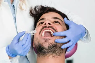 iSmile Orthodontics patient being fitted with new Invisalign clear aligners