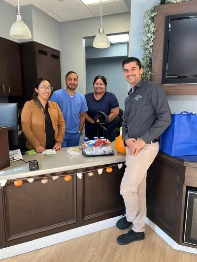Dr. Ron with staff at front desk